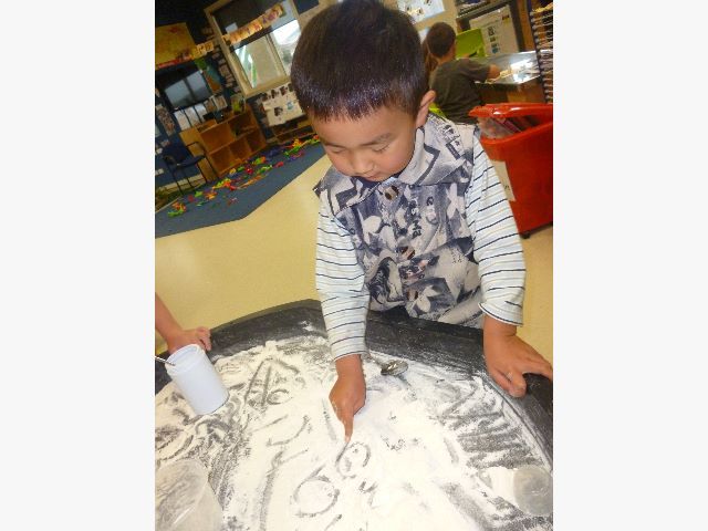 Marc is writing his name. 2 十二月 2014